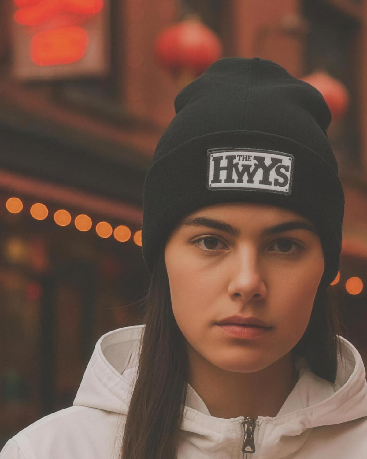 HwYs Embroidered Cuffed Beanie worn on-street, THE HWYS woven patch